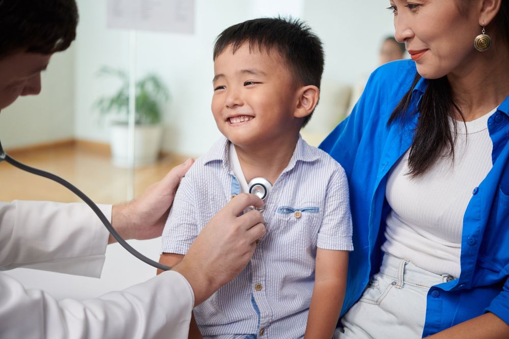boy with mom and doctor